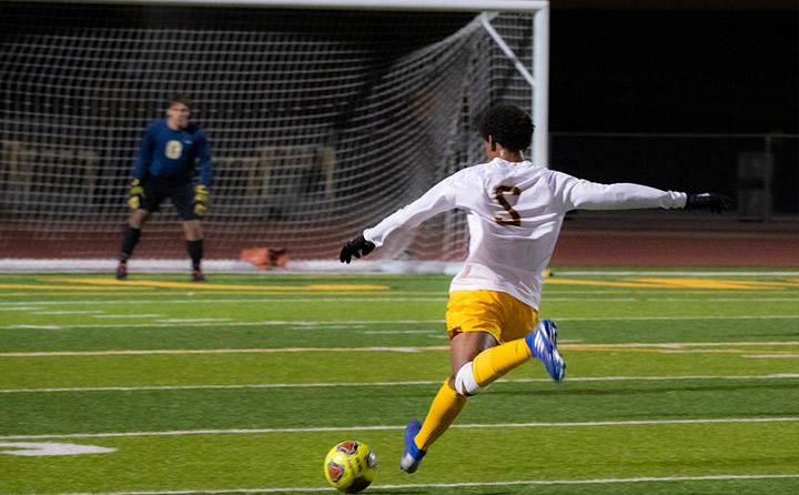 Image of Man Kicking Soccer Ball